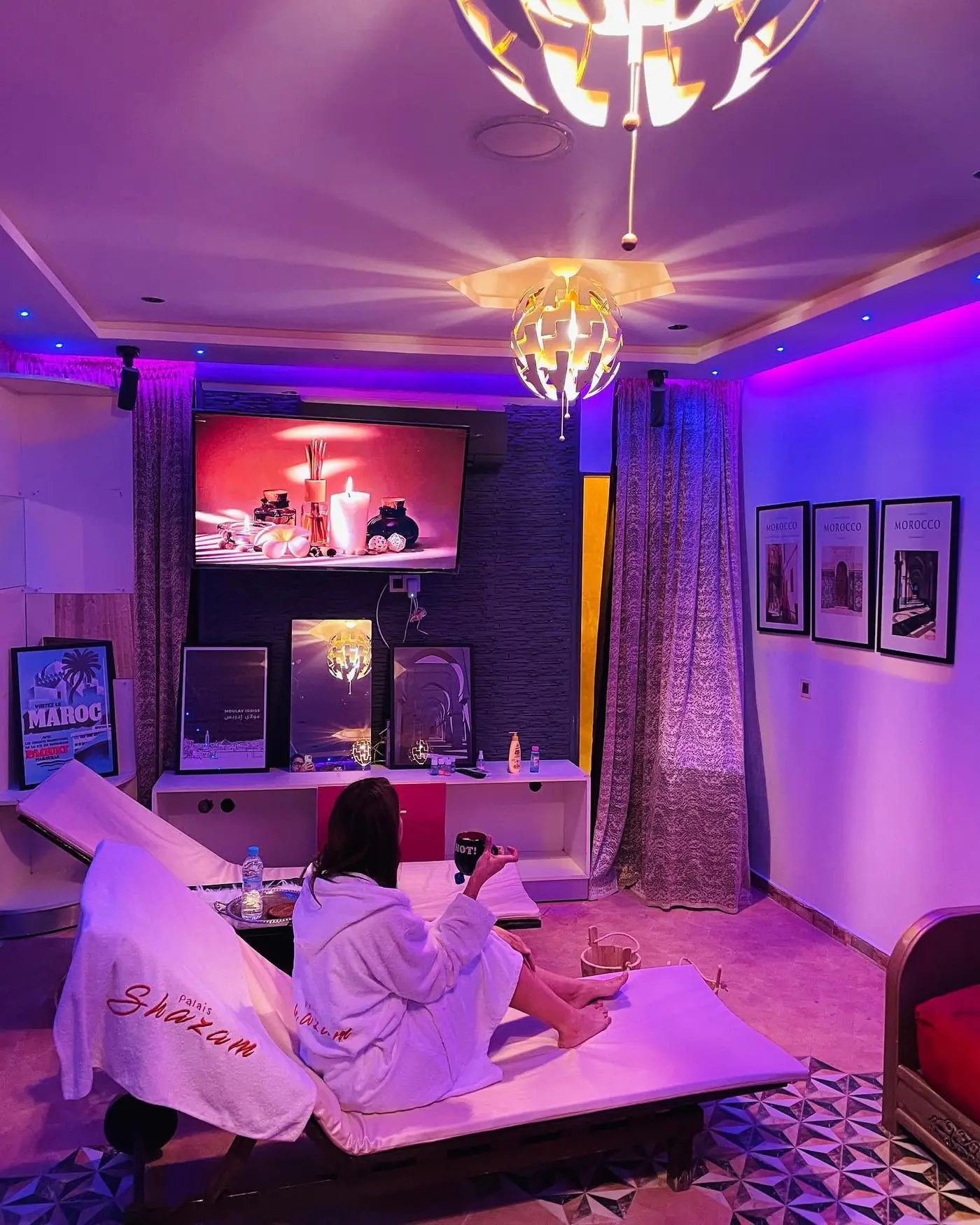 The relaxation room at Palais Shazam's spa, with loungers and soft lighting